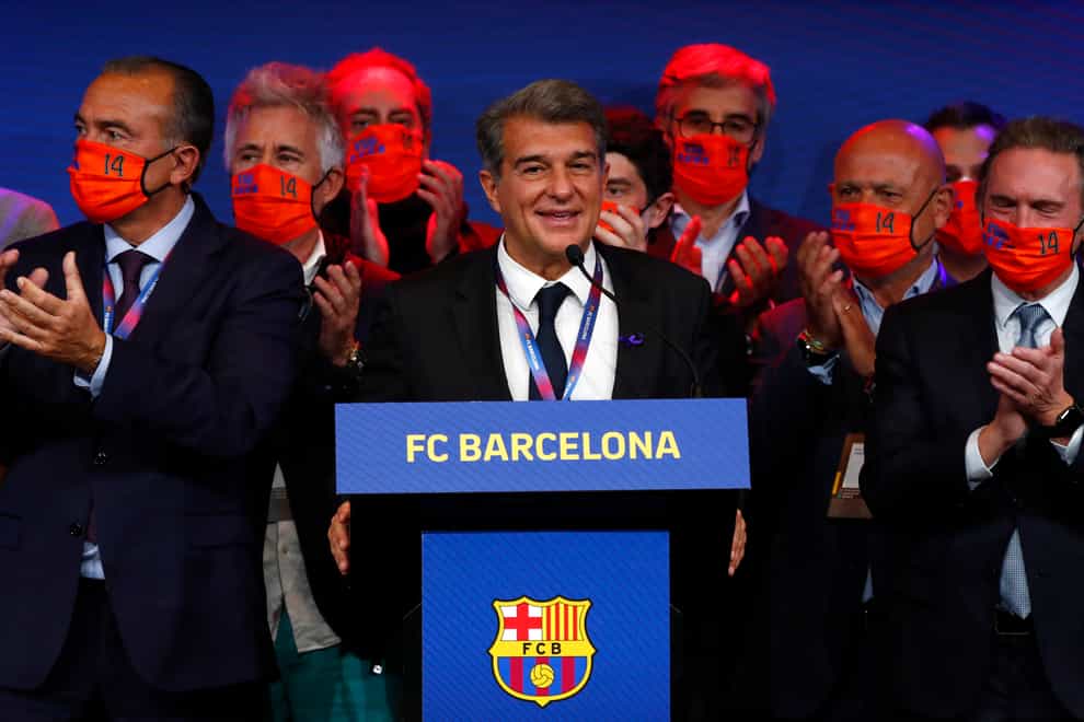 Joan Laporta, centre, will serve a second term as Barcelona president (Joan Monfort/AP/PA)