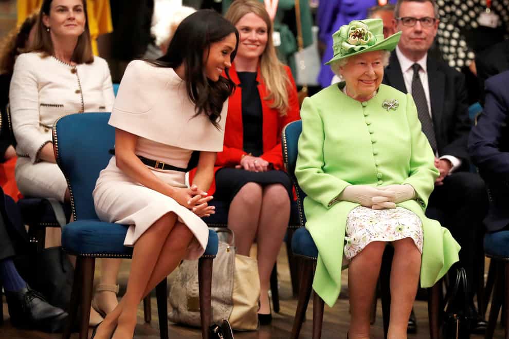 Meghan at a royal engagement with the Queen