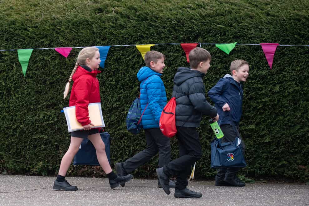 Children arrive at Thomas Bullock Church of England Academy in Shipdham, Norfolk