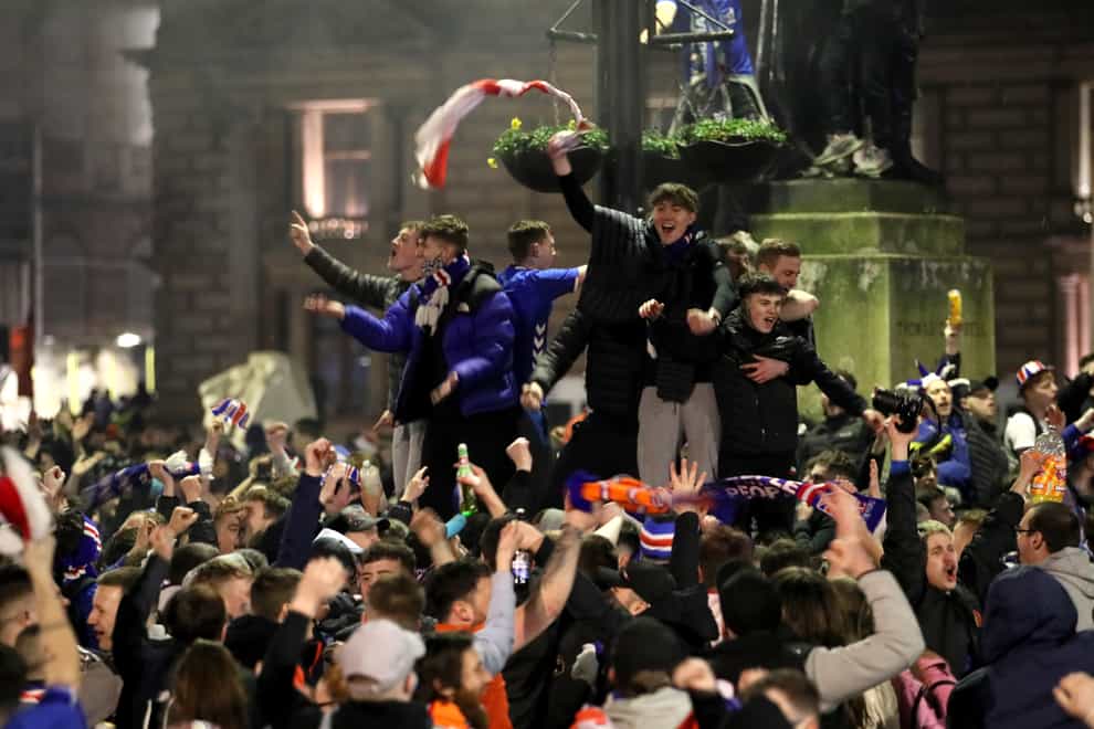 Fans celebrate in George Square after Rangers won the Scottish Premiership title