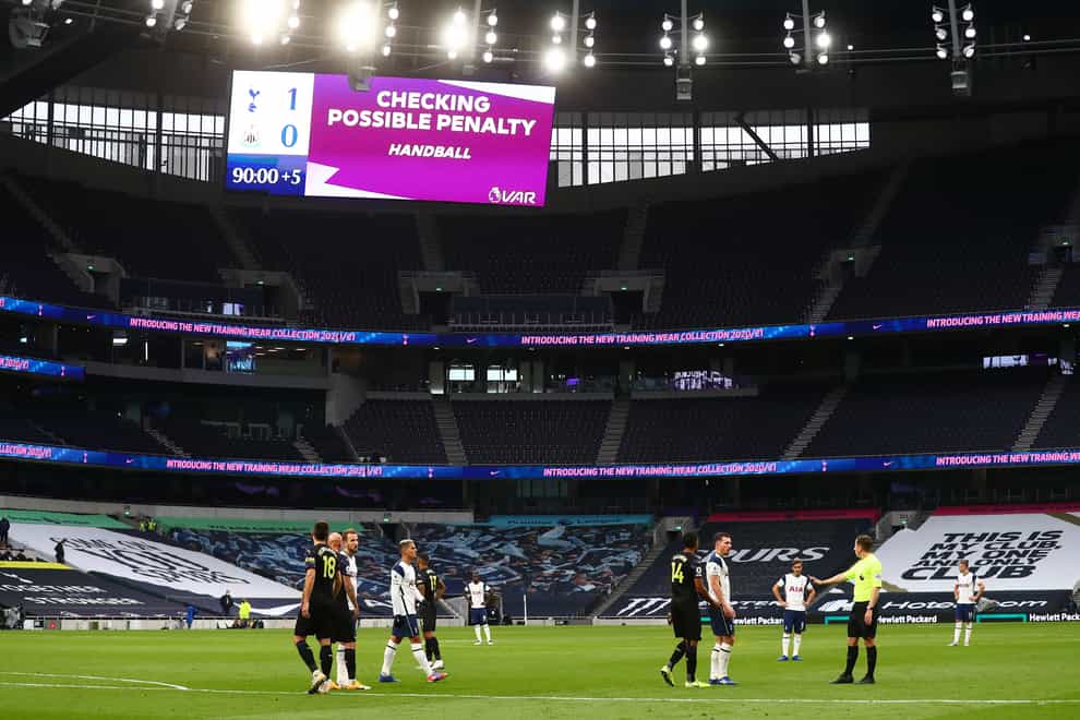 The big screen indicates that the VAR is checking for a possible penalty during the Premier League match at Tottenham