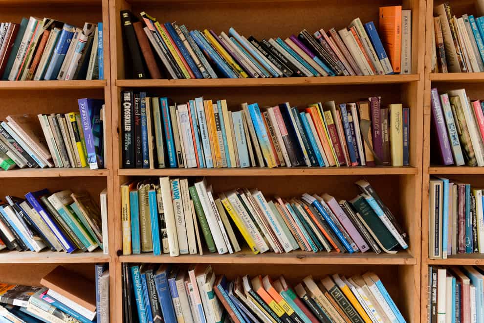 General view of books on a bookshelf at Hay Castle at Hay Festival in Powys (Ryan Philips/AP)