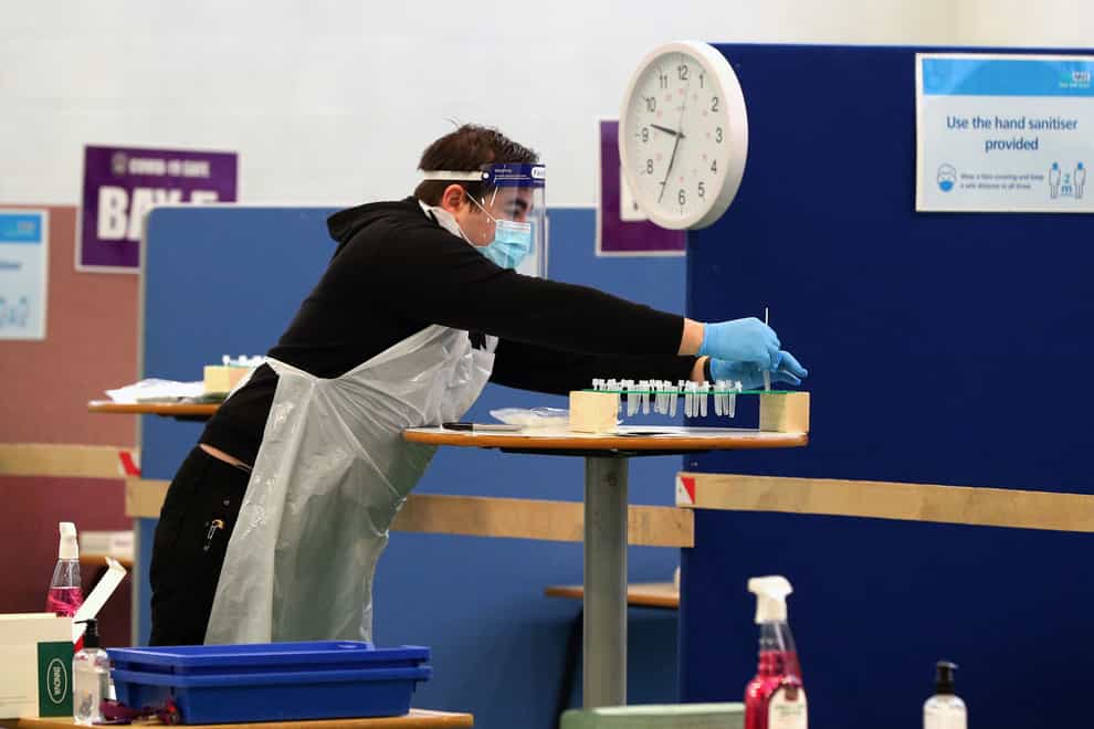 Staff at Gateacre comprehensive school in Liverpool prepare to start testing their pupils for the coronavirus (Peter Byrne/PA)