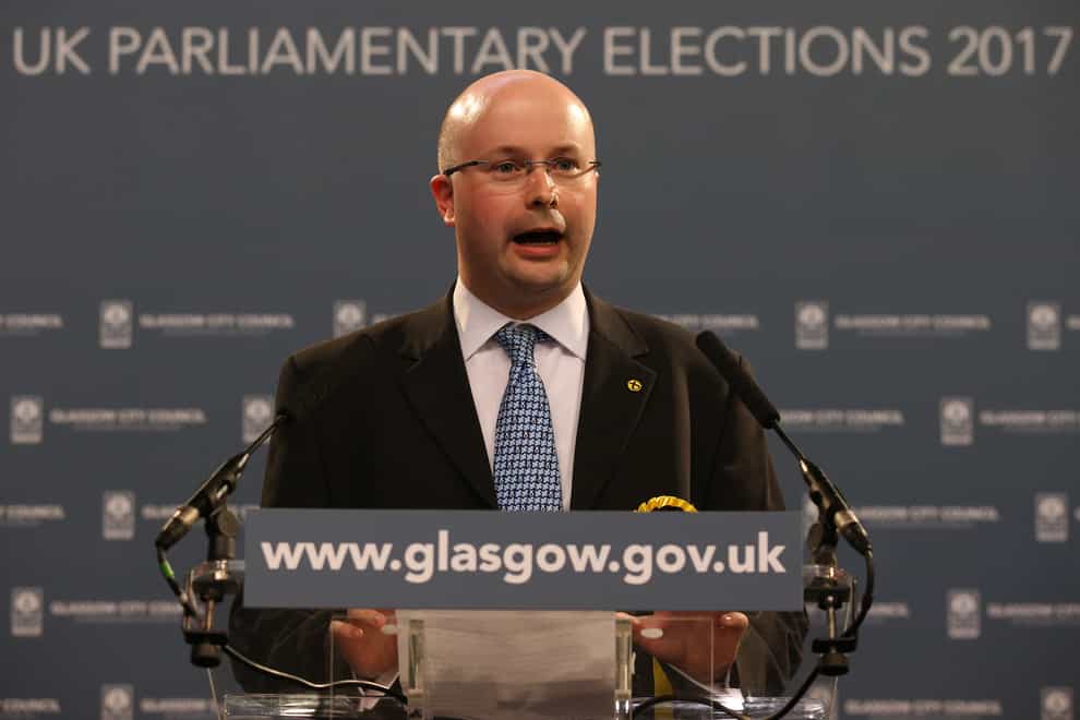 Patrick Grady stands at a lectern
