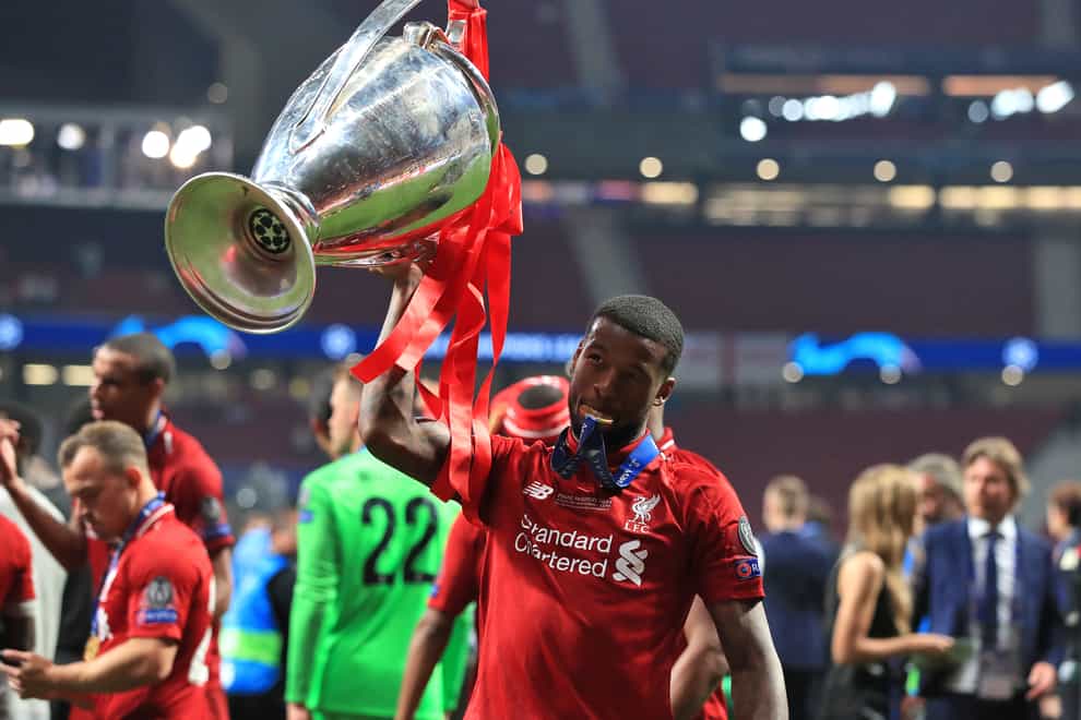 Liverpool’s Georginio Wijnaldum celebrates with the trophy after winning the Champions League in 2019