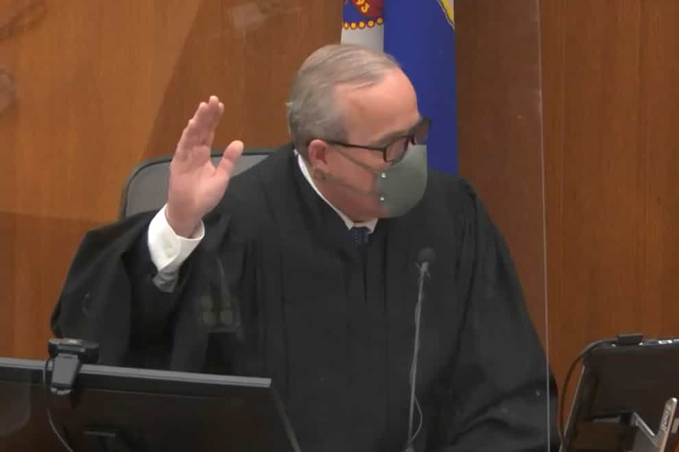 Hennepin County Judge Peter Cahill swears in a potential juror as he presides over jury selection in the trial of former Minneapolis police officer Derek Chauvin on Tuesday, March 9, 2021 at the Hennepin County Courthouse in Minneapolis