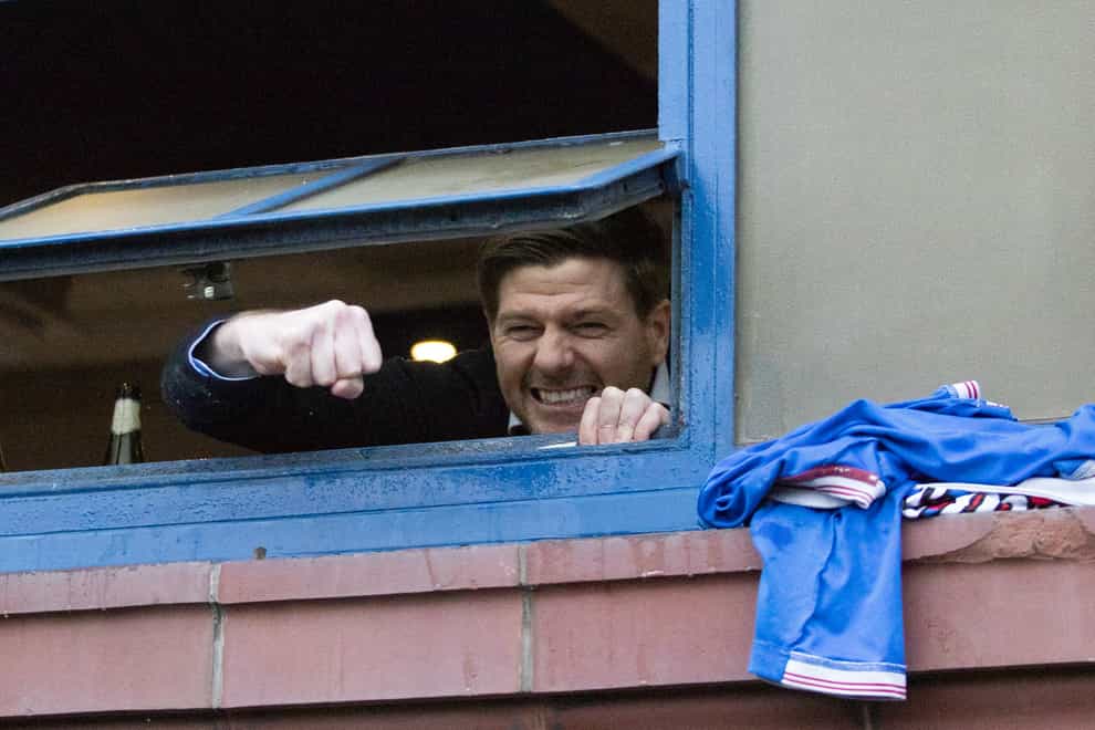 Steven Gerrard celebrates through the window