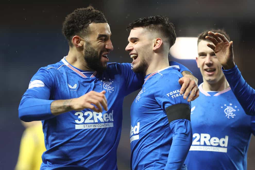 Connor Goldson (left) is still in dreamland after Rangers' title triumph