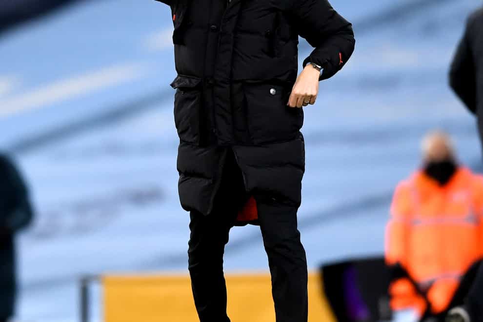 Pep Guardiola points on the touchline