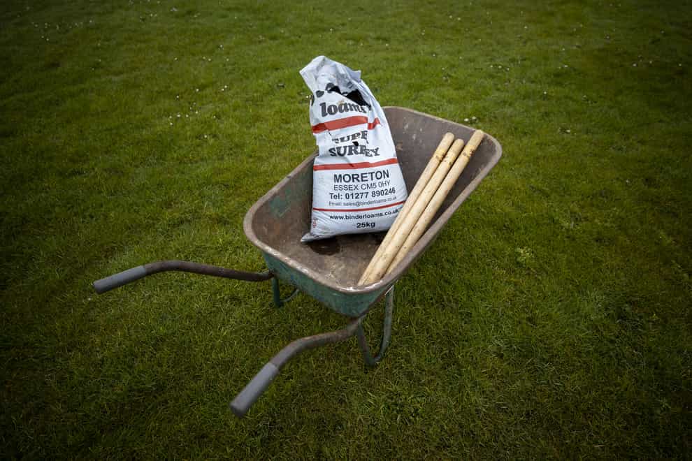 Loam in a wheelbarrow on the crease of Carrickfergus Cricket Club. The special cricket pitch soil used for generations may have to be dug up and replaced due to the Northern Ireland Protocol, according to a groundsman (Liam McBurney/PA)