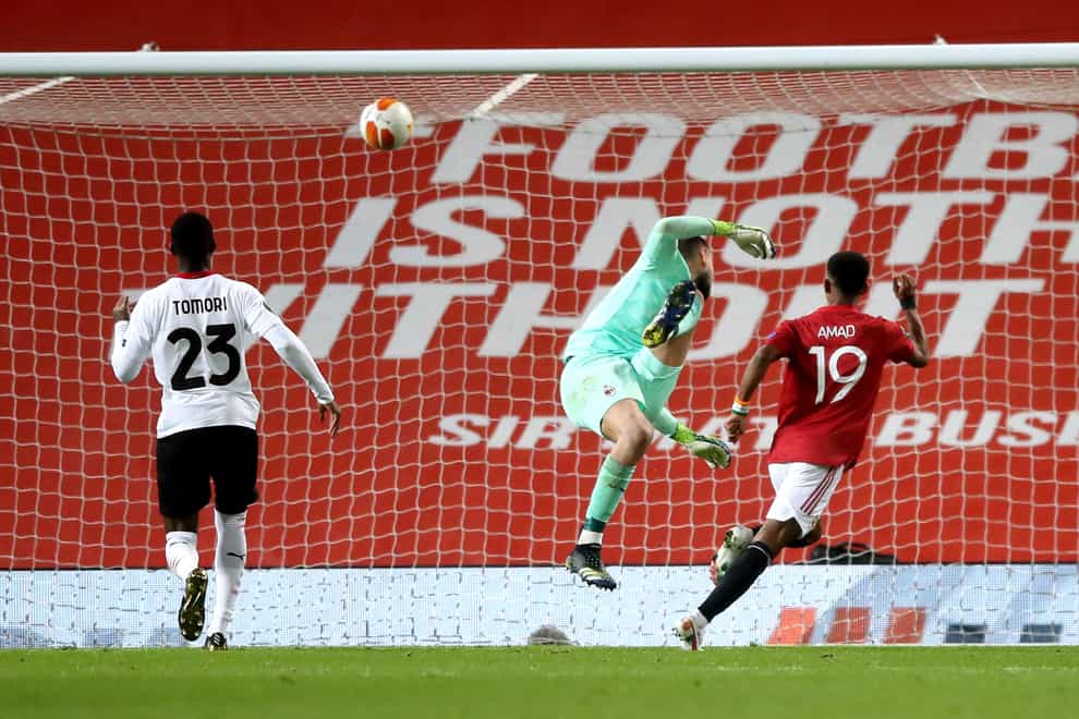 Manchester United’s Amad Diallo (right) scores against AC Milan