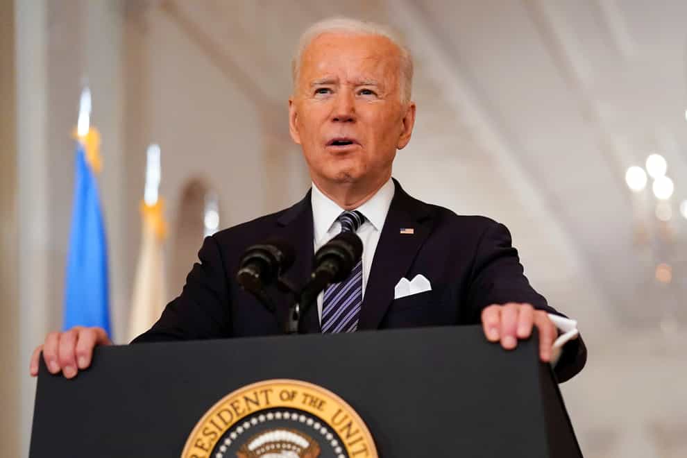 President Joe Biden speaks at a lectern