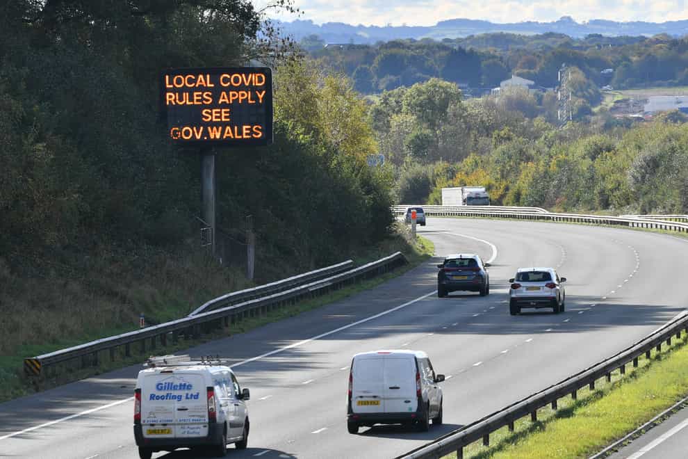 A matrix sign on the M4 motorway near Cardiff in Wales reminds motorists of coronavirus rules