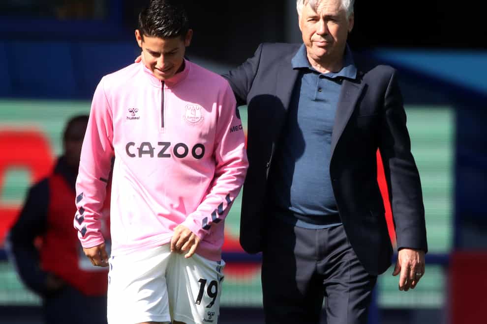 Everton manager Carlo Ancelotti puts his arm around James Rodriguez