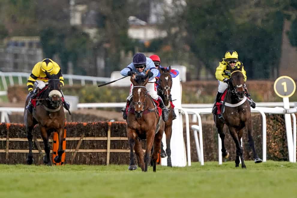 Orbys Legend and Richard Johnson (middle) on their way to victory in the Paddy Power "National Hunt" Novices' Hurdle at Sandown