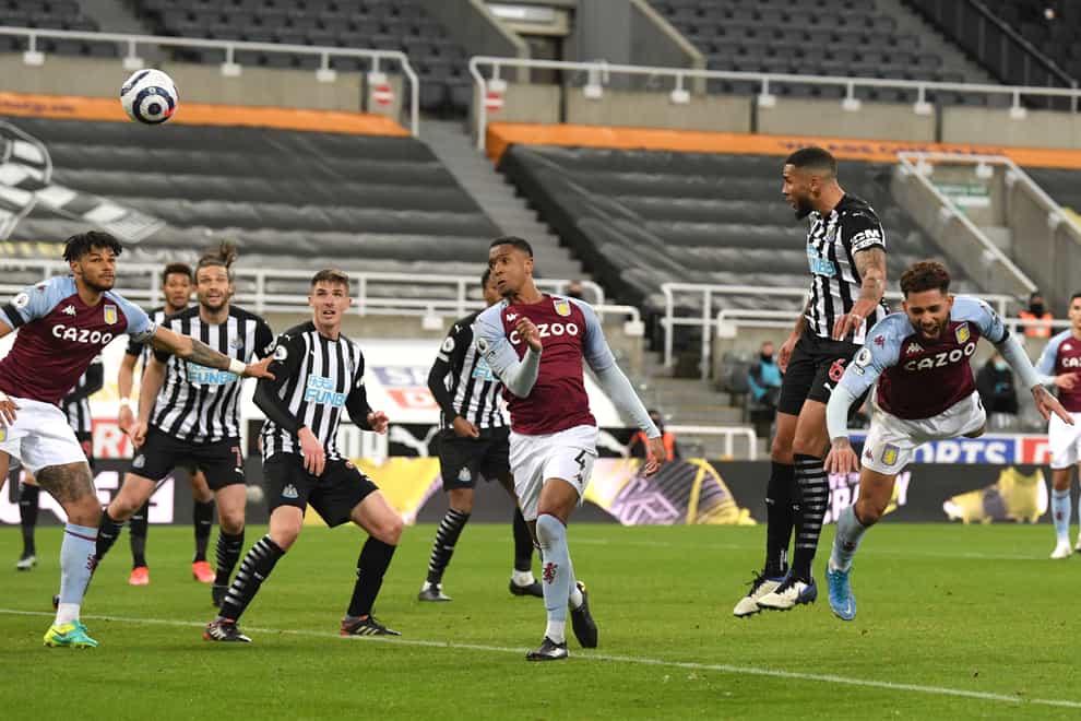 Newcastle’s Jamaal Lascelles, second right, scores a late equaliser against Aston Villa