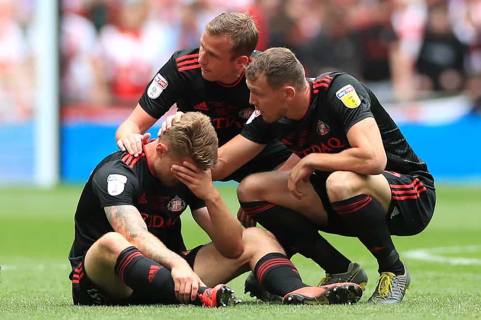 Sunderland’s Max Power (left) is consoled by team-mates after the 2019 loss to Charlton