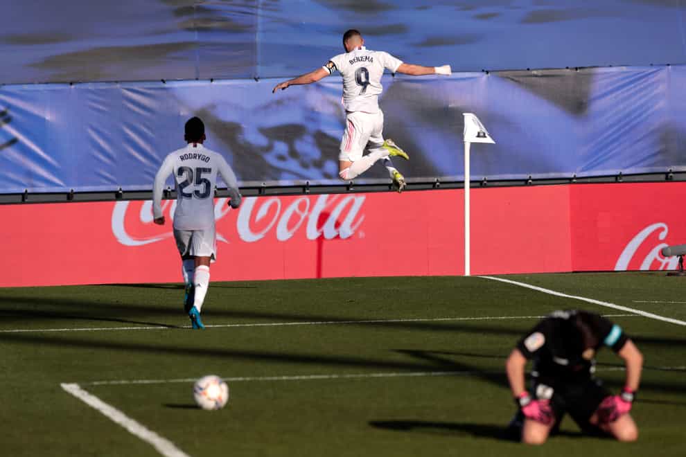 Karim Benzema scored a late double to lift Real to victory