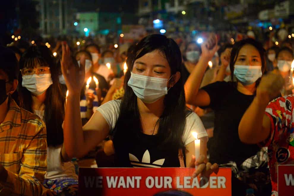 Protesters attend a candlelight night rally in Yangon, Myanmar