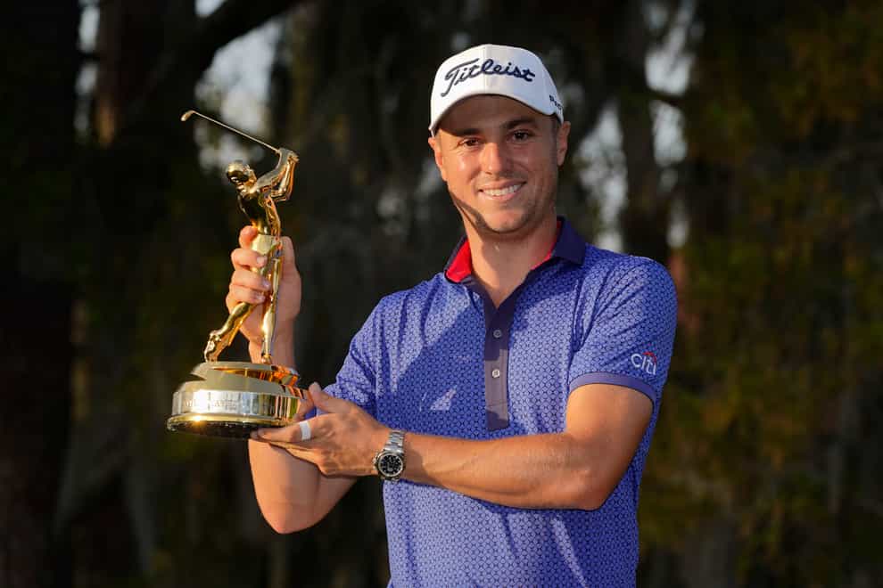Justin Thomas holds the trophy after winning The Players Championship