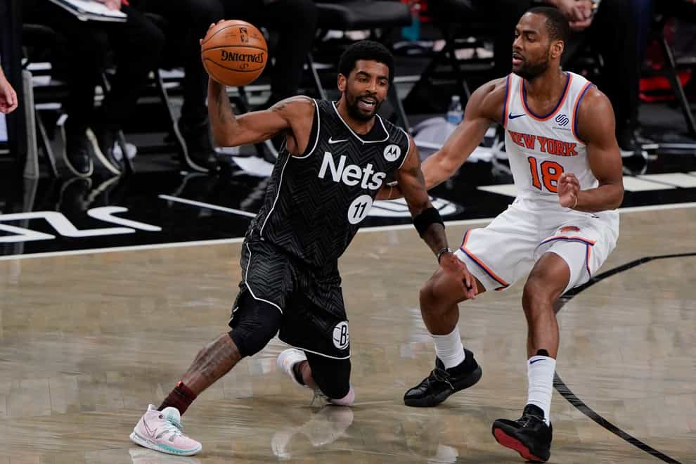 Kyrie Irving, left, helped Brooklyn down the Knicks