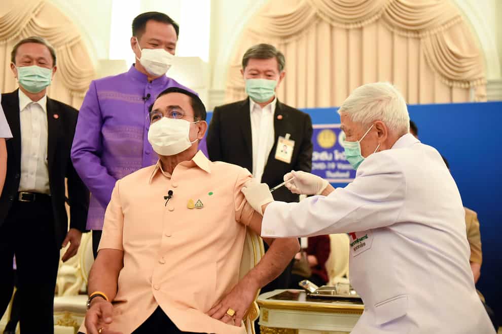 Thailand’s prime minister Prayuth Chan-ocha, front left, receives a shot of the AstraZeneca’s Covid-19 vaccine at government house in Bangkok, Thailand (AP)