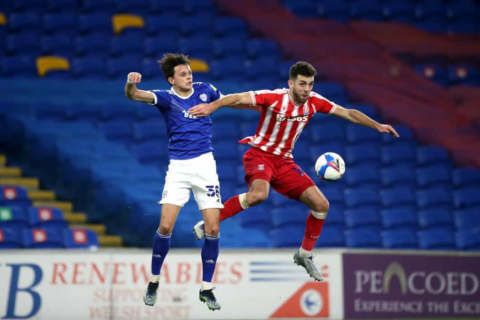 Cardiff's Perry Ng (left) and Stoke's Tommy Smith in action