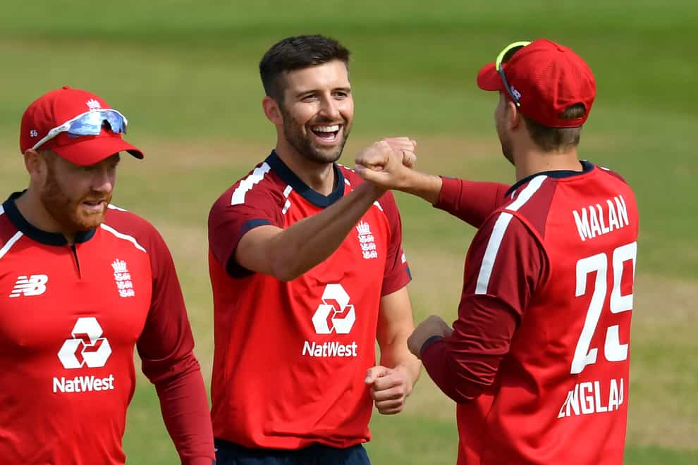 Mark Wood (centre) is happy to keeping proving himself in England's T20 side.