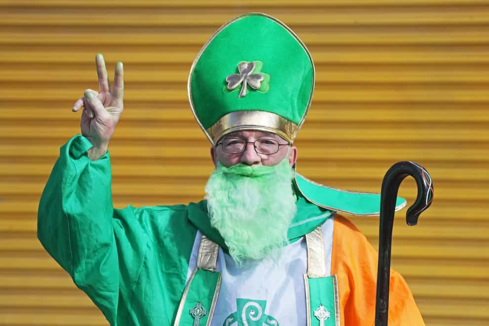 A man dressed as St Patrick on O’Connell Street in Dublin (Brian Lawless/PA)