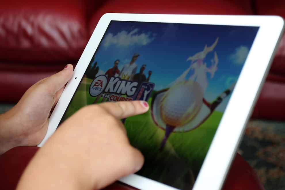A child using an Apple iPad tablet