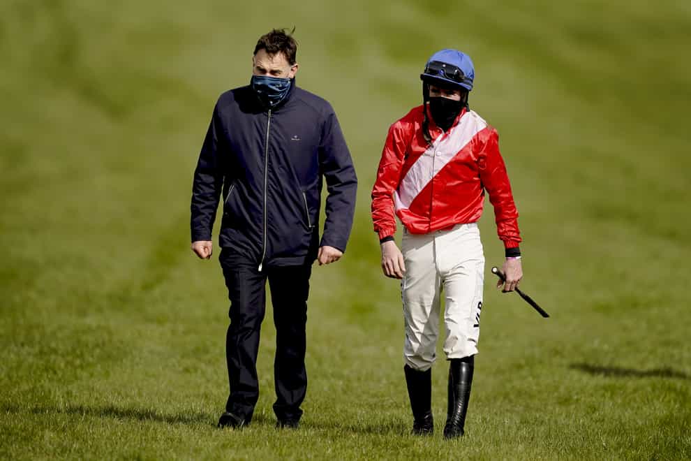 Trainer Henry de Bromhead with jockey Jack Kennedy after the fall of Envoi Allen