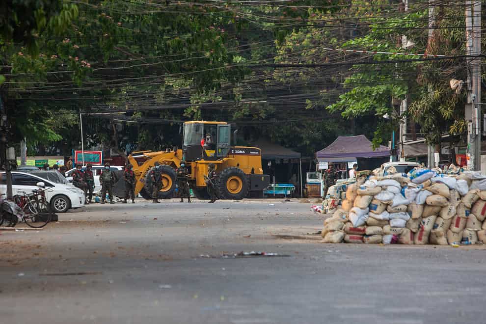 Police and military occupy a roadblock in Yangon, Myanmar