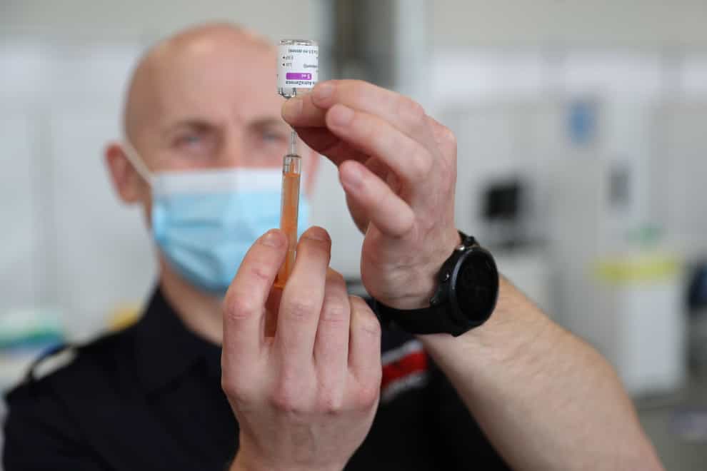 A dose of the Oxford/AstraZeneca coronavirus vaccine is prepared (Andrew Matthews/PA)