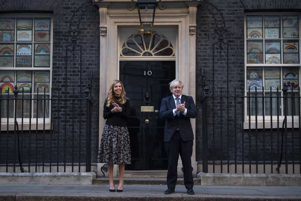 Prime Minister Boris Johnson and his fiancee outside 10 Downing Street one year on