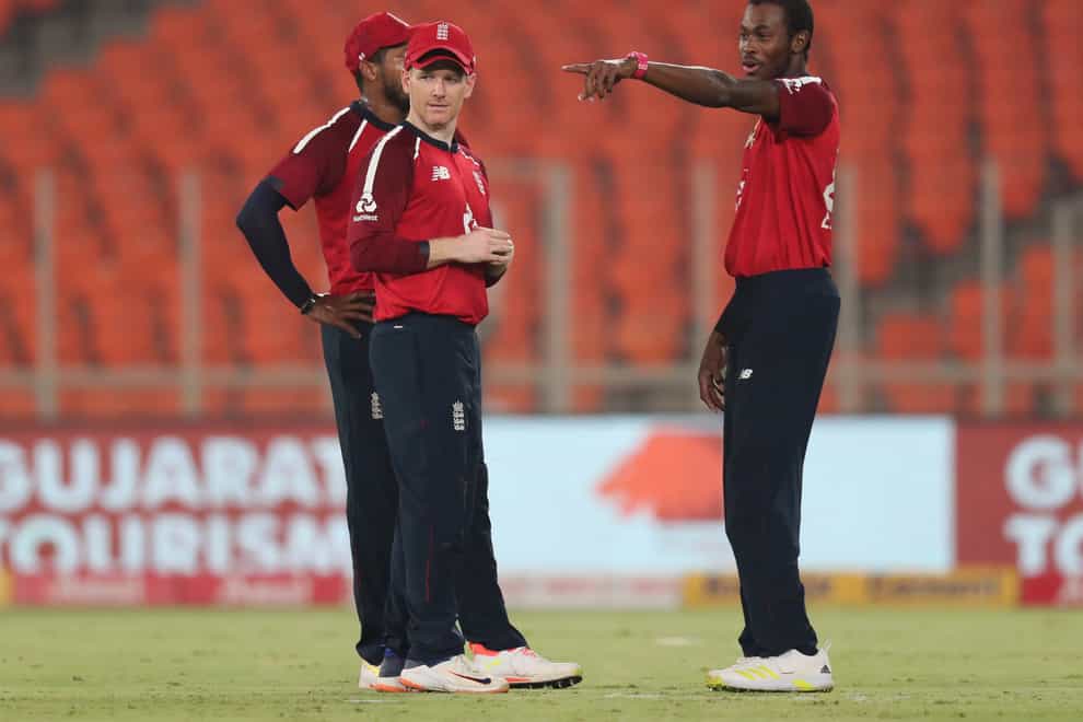 Jofra Archer, right, interacts with captain Eoin Morgan