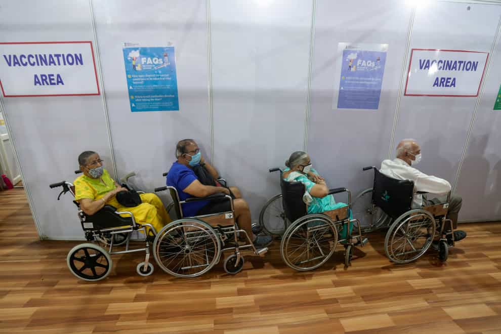 Elderly Indians wait to receive a Covid-19 vaccine in Mumbai