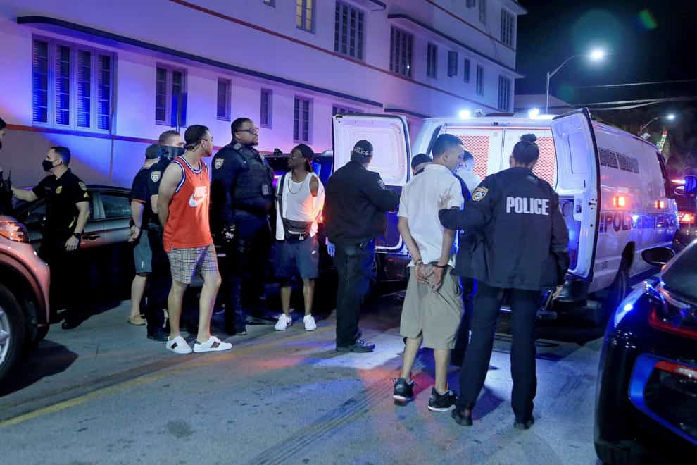 City of Miami Beach Police officers arrest several males on Ocean Drive and 10th Street as spring break has officially begun