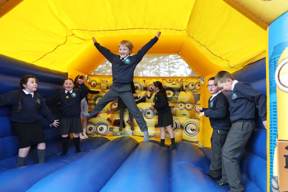 Templeton Linn, seven, enjoys the bouncy castle at Braniel Primary School in east Belfast