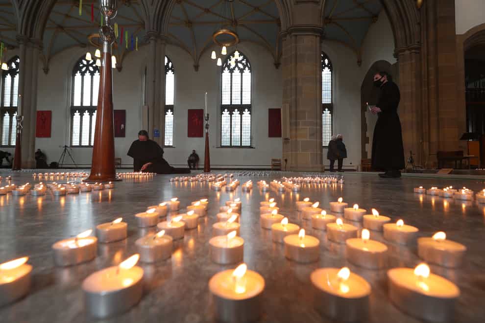 Candles are lit during the National Day of Reflection at Blackburn Cathedral