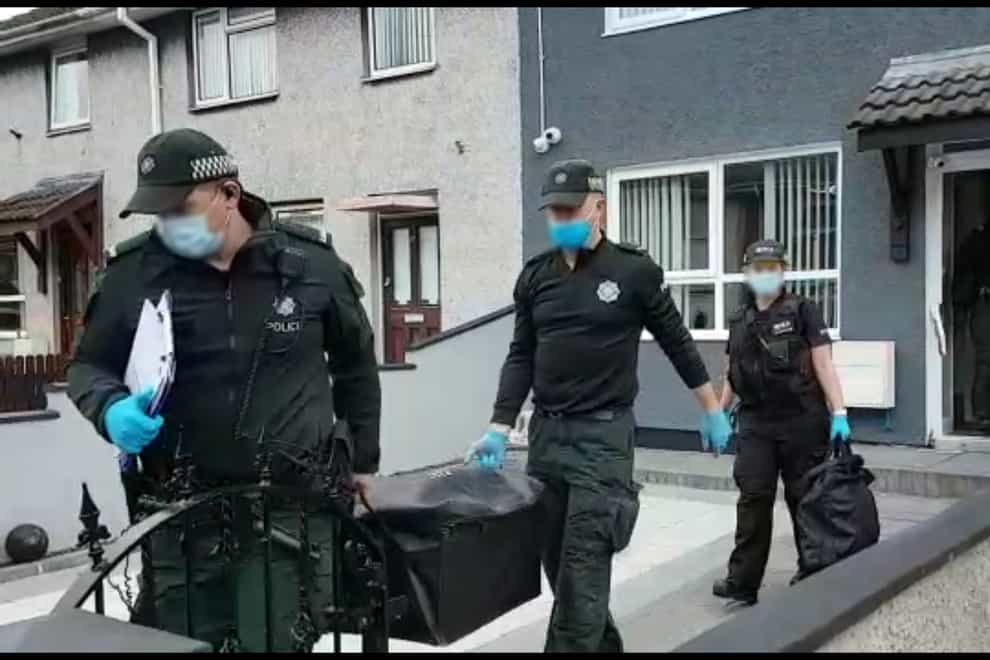 Five men have been arrested following raids targeted alleged drug dealing by a paramilitary group in Northern Ireland
