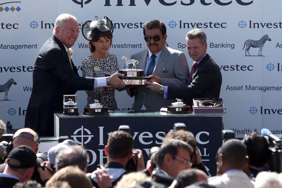Lady Cecil presents Sheikh Hamdan with the trophy after the Oaks victory of Taghrooda