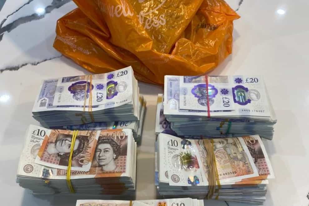 Some of the cash seized in raids on a suspected drugs gang whose ringleaders were earning more than £1million per year