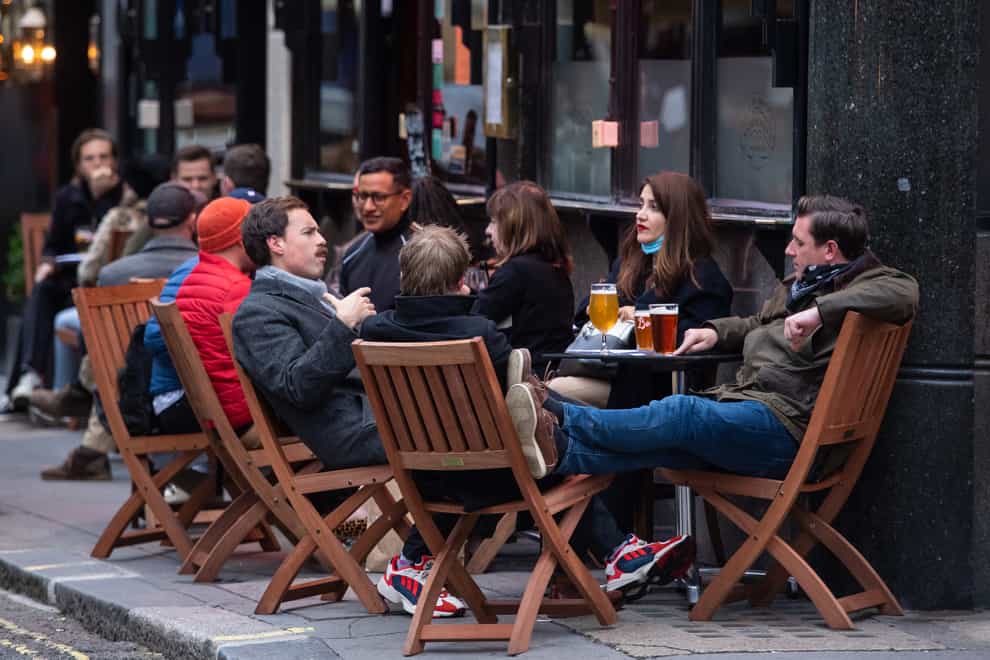 Customers outside a pub in Soho