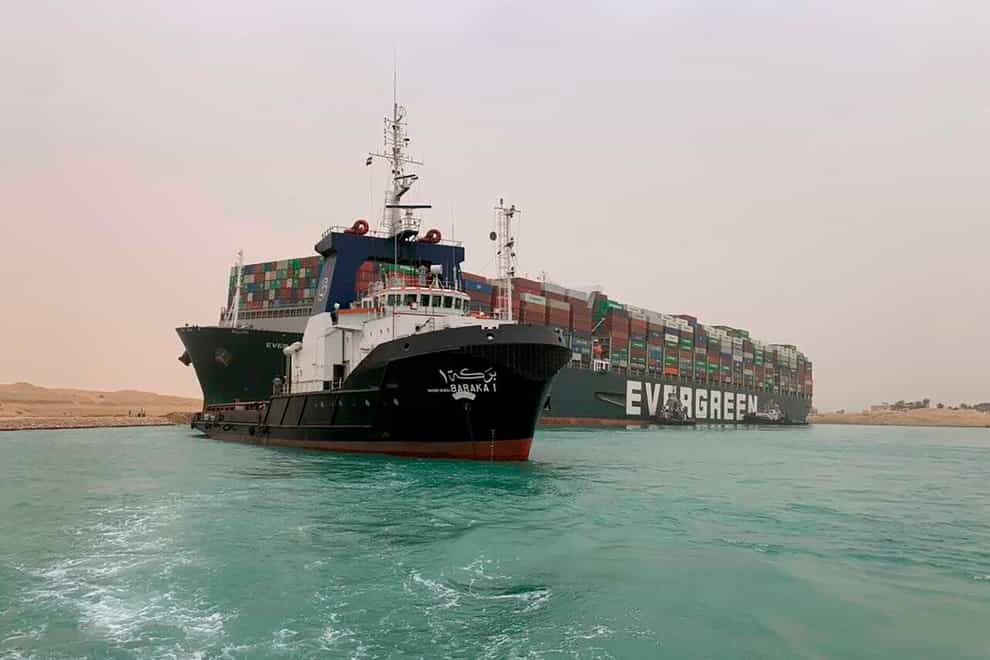 Suez Canal Authority boats come to the assistance of the Ever Given on Wednesday
