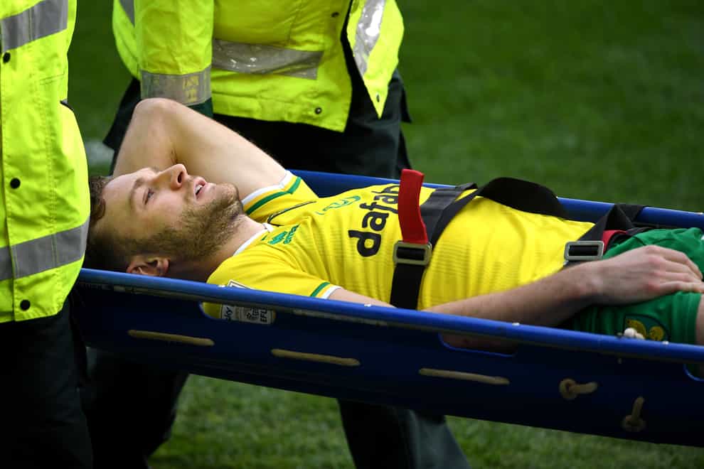 Norwich defender Ben Gibson is carried off on a stretcher