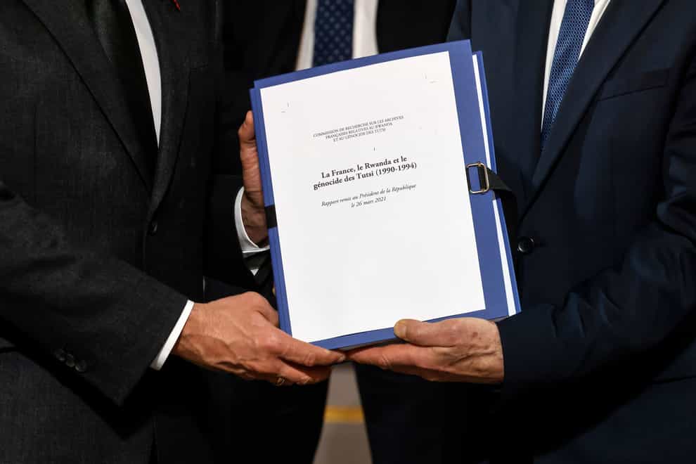 The report on France’s role in 1994’s Rwandan genocide is given by Historian and Commission chief, Vincent Duclert to French President Emmanuel Macron, at the Elysee Palace, in Paris (Ludovic Marin/AP)