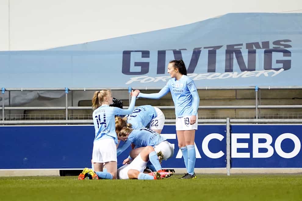 Chloe Kelly celebrates with her Manchester City team-mates after her late goal on Saturday.