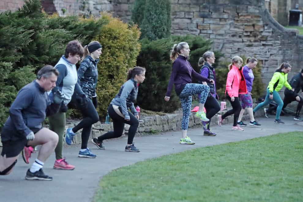 People taking part in a boot camp exercise class in Springhead Park, Rothwell, Leeds