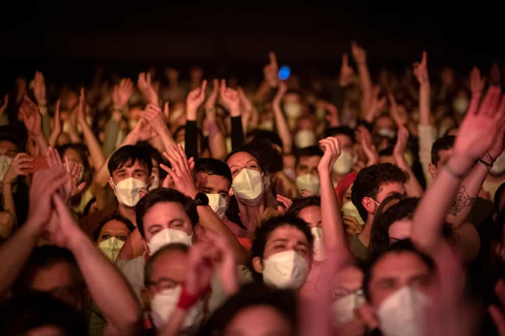 Revellers enjoy a music concert in Barcelona, Spain