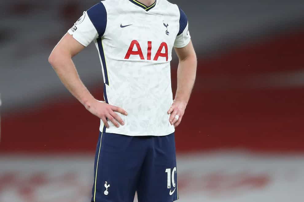 Tottenham striker Harry Kane stands with his hands on his hips
